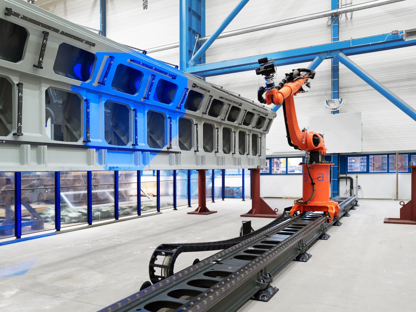 Industrial robotic arm in manufacturing facility.