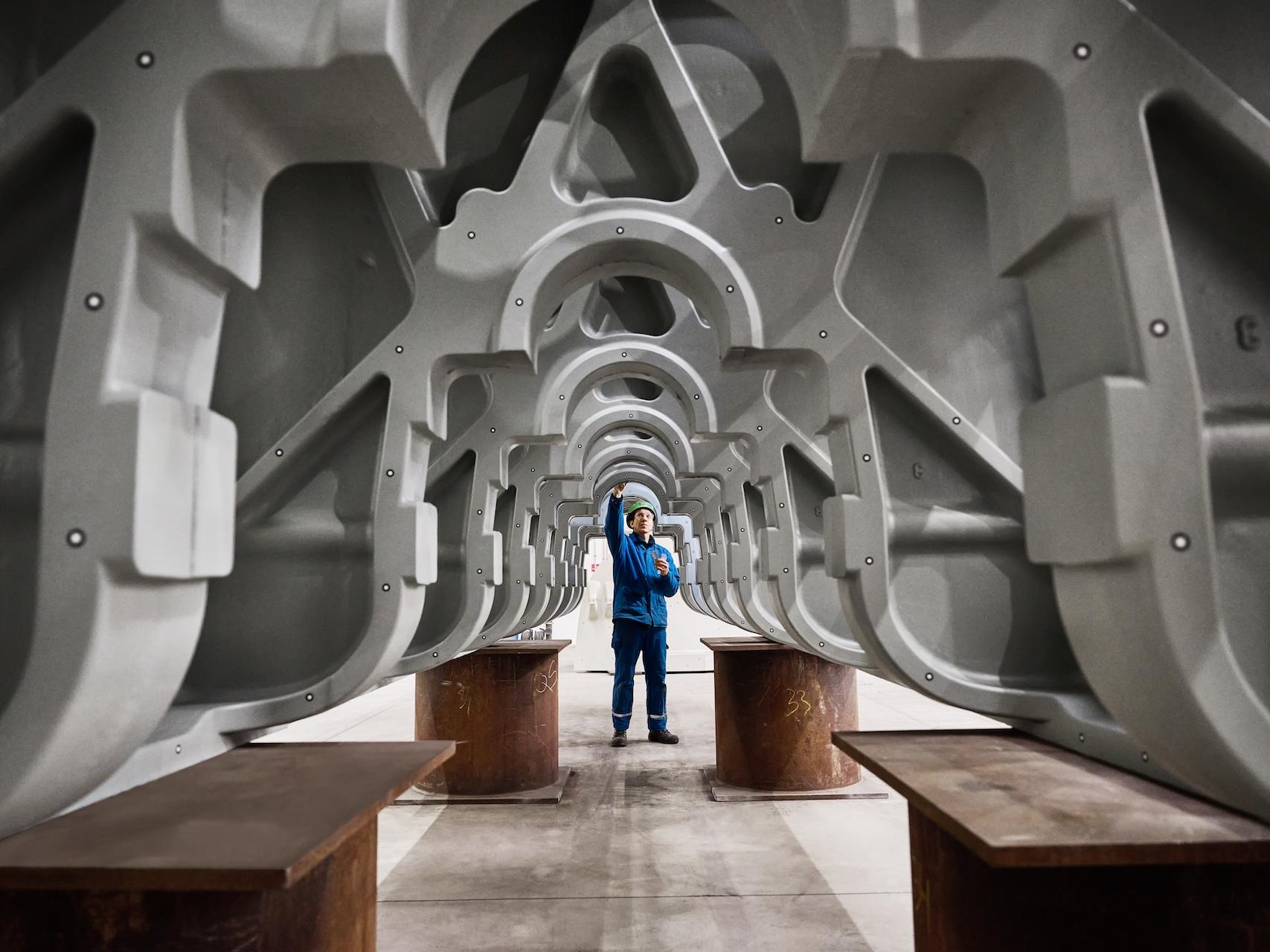 Engineer inspecting industrial metal framework