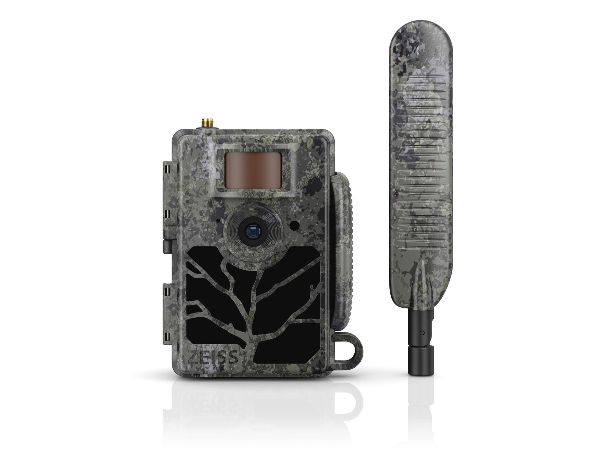 Camouflaged ZEISS trail camera with tree-branch design next to a matching external antenna.