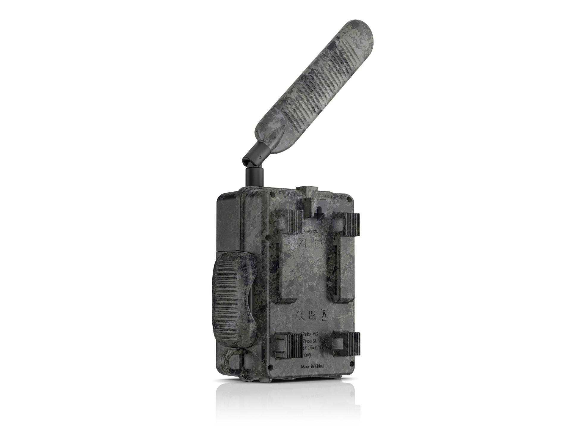 Camouflaged ZEISS trail camera with a large external antenna, viewed from a front-side angle.