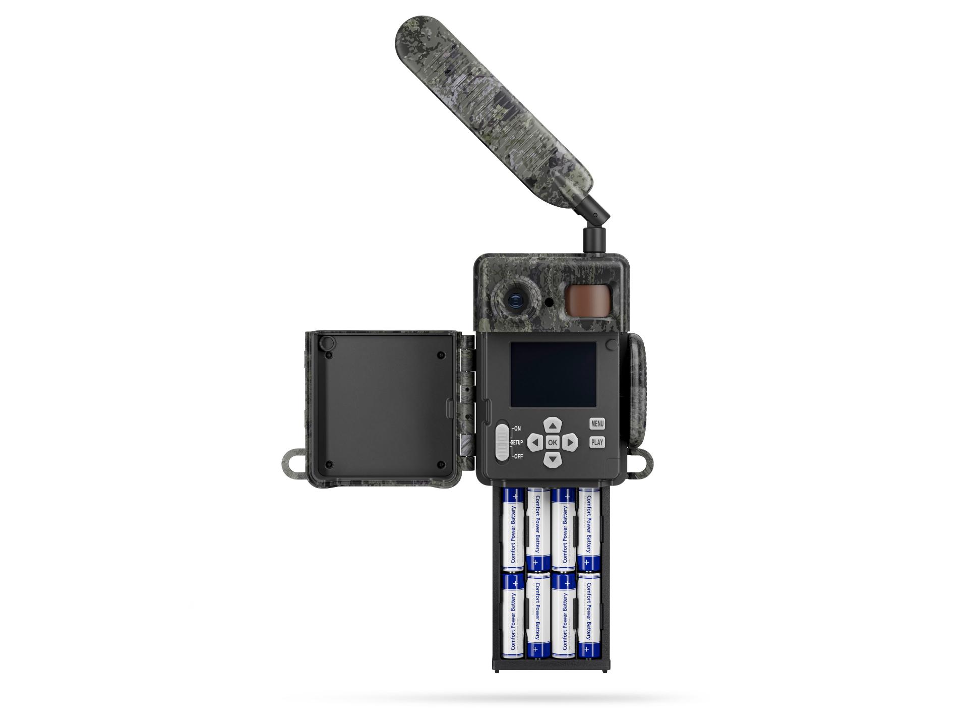 Open ZEISS trail camera with camouflage design, showing its extended antenna, display screen, control buttons, battery compartment filled with AA batteries, and side panel open.