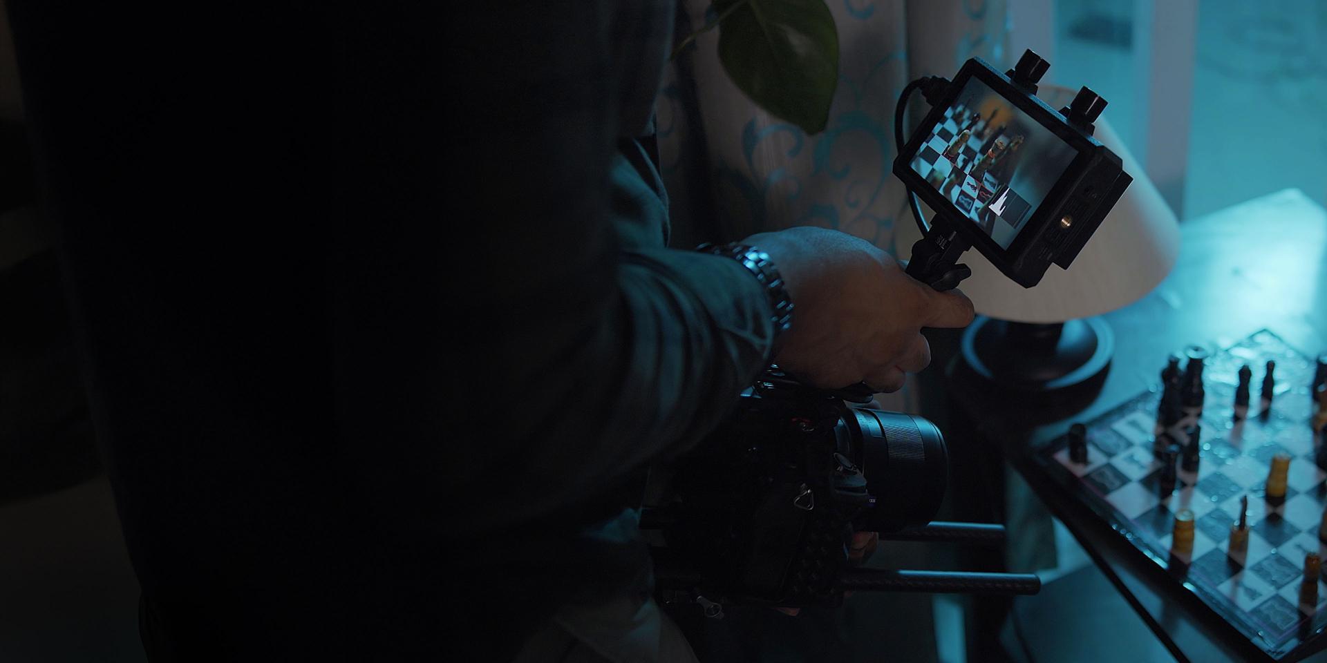 Close-up of a ZEISS loxia lens featuring the innovative De-Click gear ring, designed for smooth aperture adjustments in professional video production.