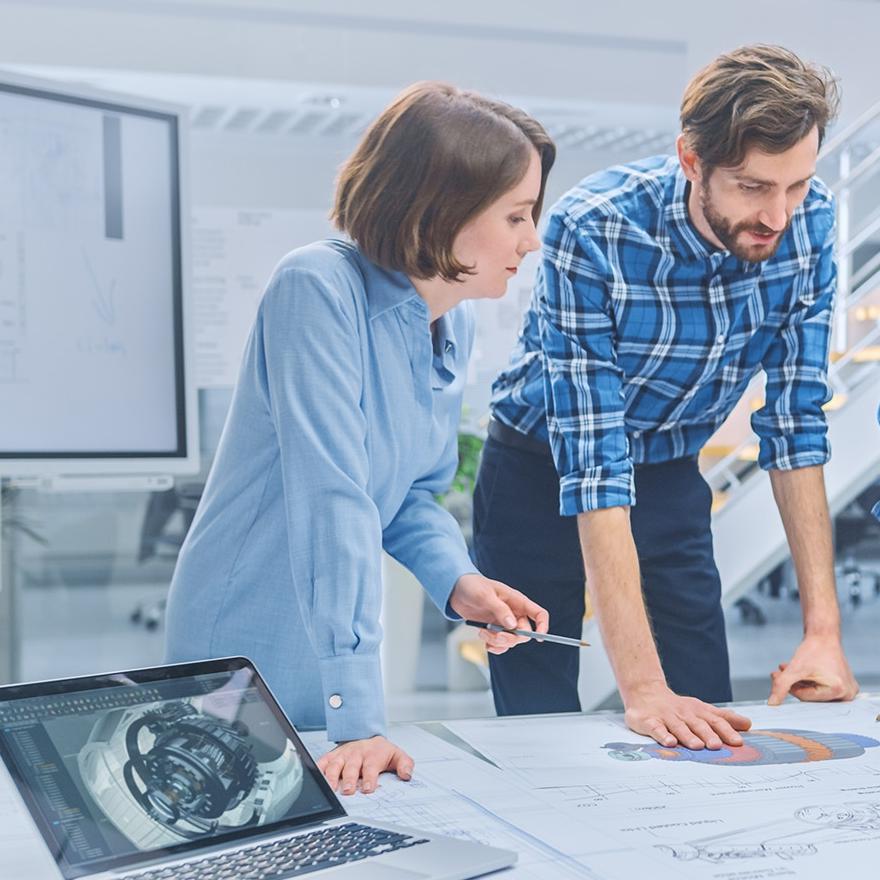  Engineers and Technicians on a Meeting Gather Around Table with Engine Design Technical Drafts, Have Discussion, Analyse Technology