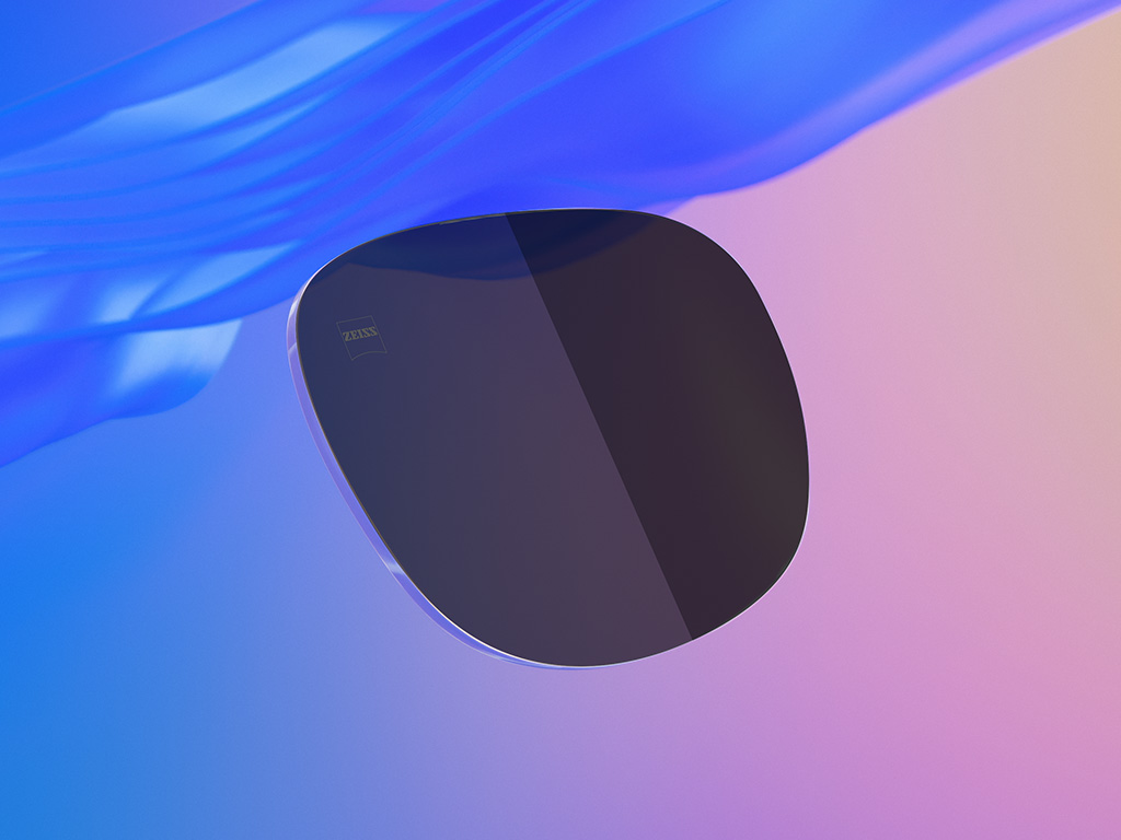 3D-CGI-Illustration eines getönten Sonnenbrillenglases, bei dem die eine Hälfte einen helleren Dunkelheitsgrad zeigt als die andere.