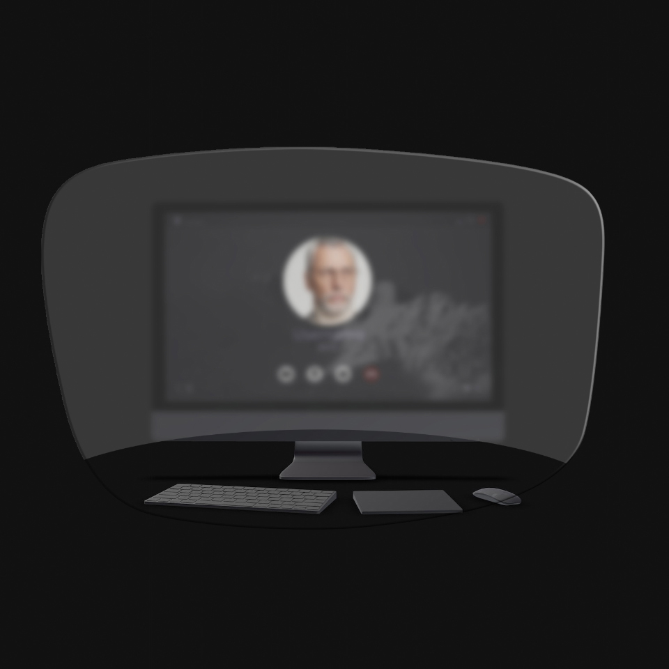 Eine schematische Darstellung, bei der der Blick durch eine Lesebrille auf einen Desktop-Computer, eine Tastatur, eine Computer-Maus und ein Buch gerichtet wird, zeigt, dass nur Objekte in nächster Nähe scharf gesehen werden können. Der Computerbildschirm ist verschwommen.