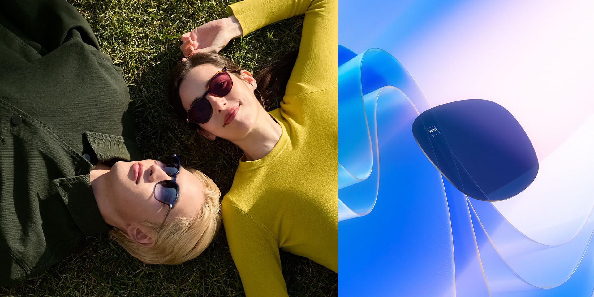 Ein Mann und eine Frau tragen Sonnenbrillen mit Sehstärke von ZEISS, liegen auf dem Gras und blicken in den Himmel. CGI-Illustration eines getönten Brillenglases, das im Sonnenlicht schwebt, zur Veranschaulichung der UV-Schutzfunktionen