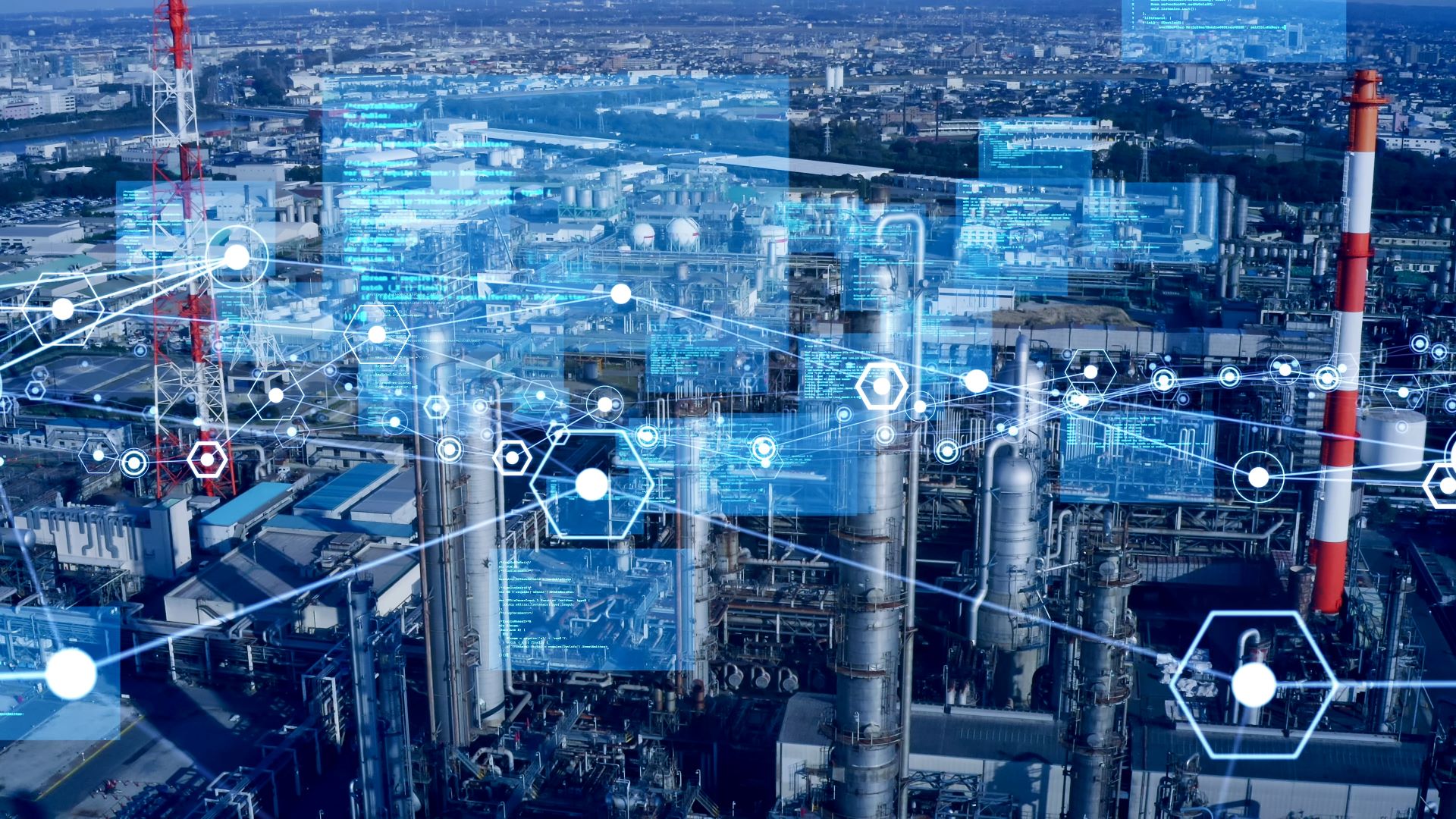 Industrielandschaft mit mehreren Fabriken und digitalen Schnittstellenüberlagerungen, die Daten und Konnektivität darstellen und die Integration der ZEISS-Technologie veranschaulichen.